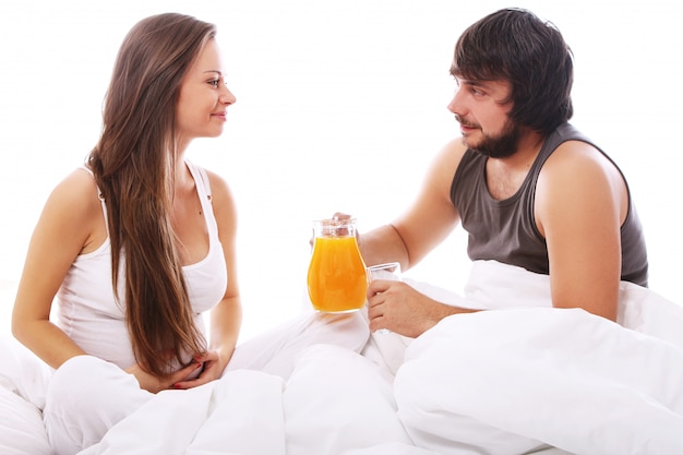 Young couple drinking orange juice