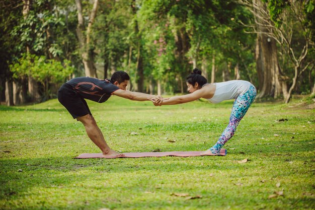 Young couple enjoying yoga