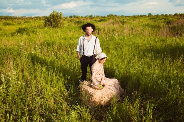 Free photo young couple in the field