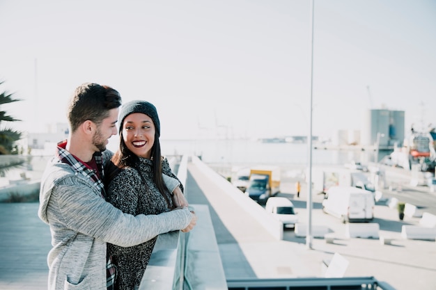 Young couple at harbor on a sunny day