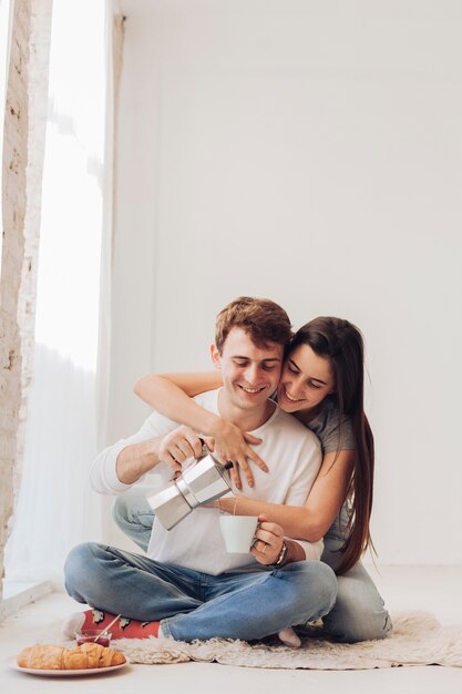 Young couple having breakfast