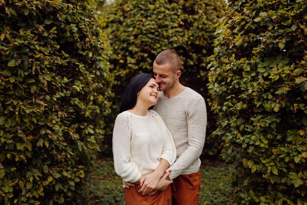 A Young couple having fun in the autumn park. Dating, attractive