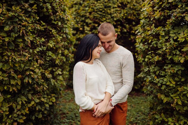 A Young couple having fun in the autumn park. Dating, attractive