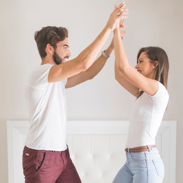 Free photo young couple having fun on bed