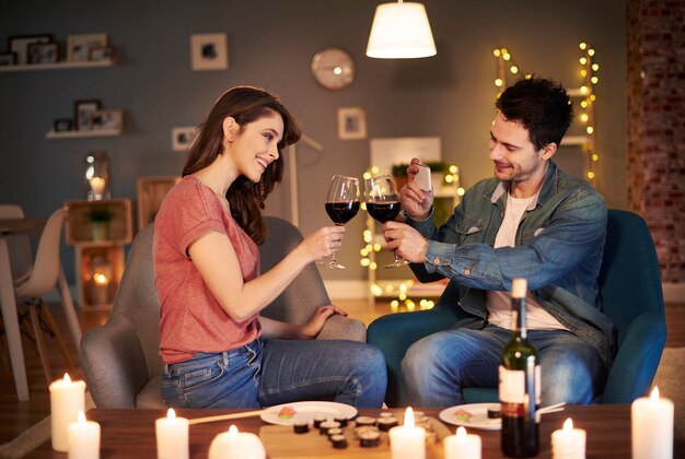 Young couple having toast for lovely evening