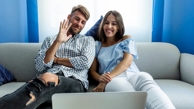 Free photo young couple having a videoconference