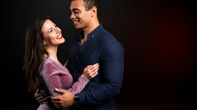 Young couple holding each other for new years eve