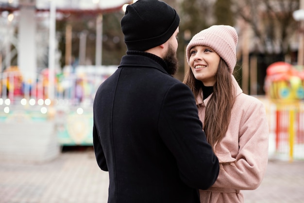 Free photo young couple holding hands