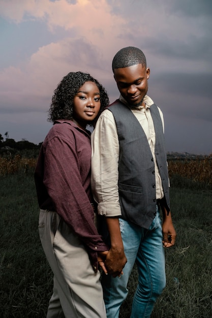 Free photo young couple holding hands