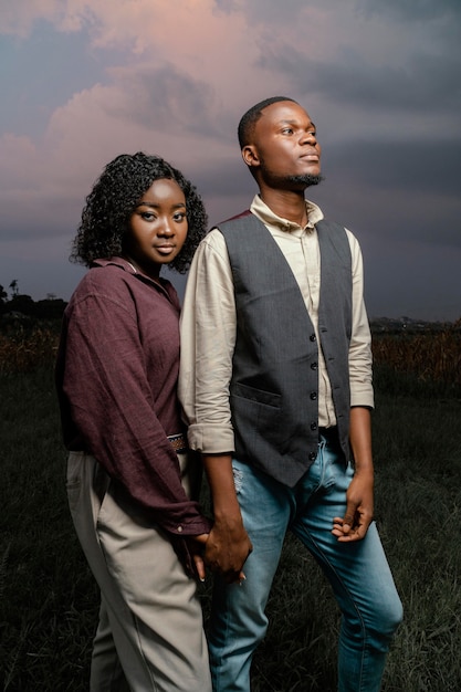 Free photo young couple holding hands