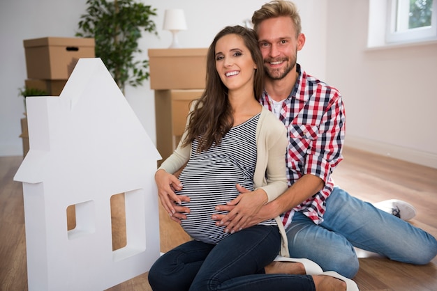 Young couple at home next to white house