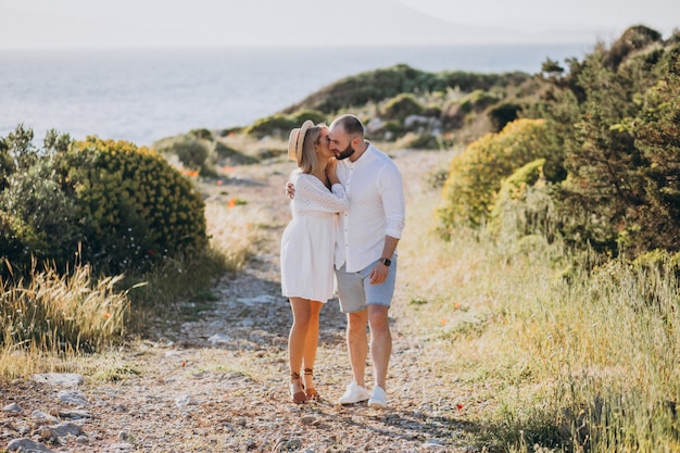 Young couple on honeymoon in Greece by the sea