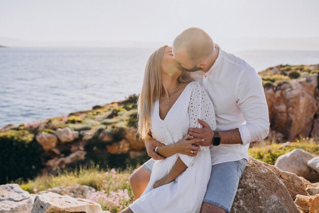 Young couple on honeymoon in Greece by the sea