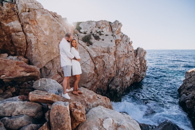Young couple on honeymoon in Greece by the sea