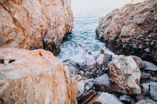 Young couple on honeymoon in Greece by the sea