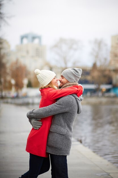 Young couple hugging and looking at each other