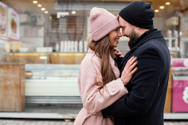 Young couple hugging and looking at each other