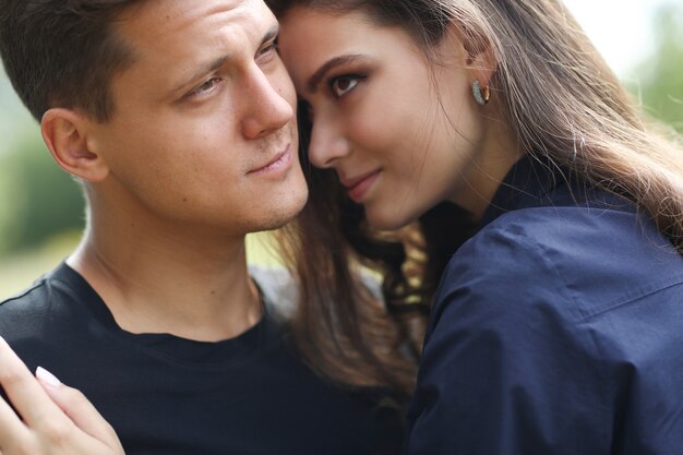 Young couple hugging outdoors