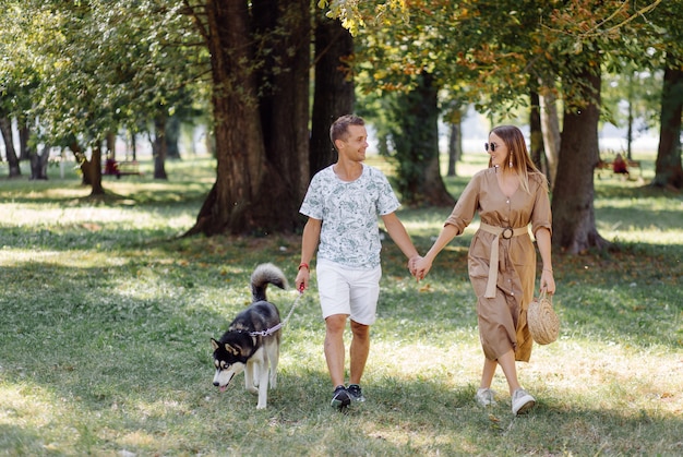 Young couple and husky