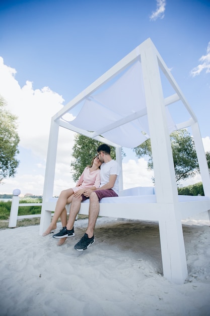 Young couple kissing on a bed