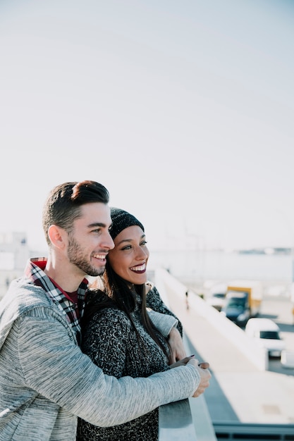 Young couple looking at harbor