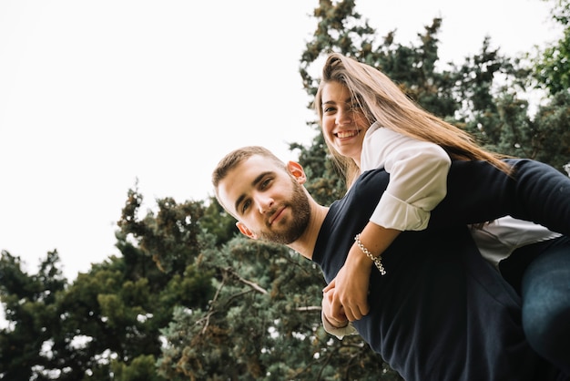 Free photo young couple in love from below