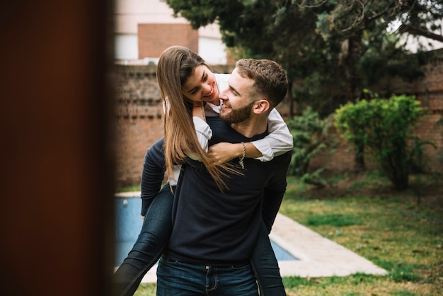 Young couple in love in front of swimming pool