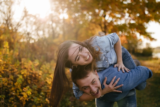 Young couple in love. A love story in the autumn forest park