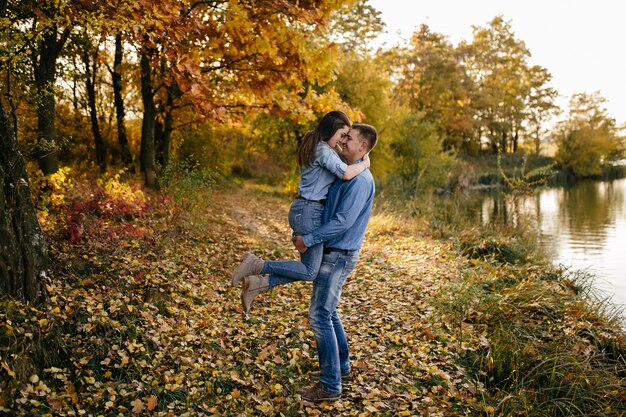 Young couple in love. A love story in the autumn forest park