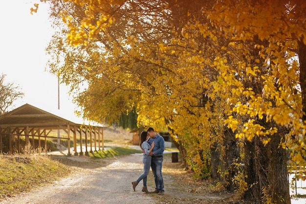 Young couple in love. A love story in the autumn forest park