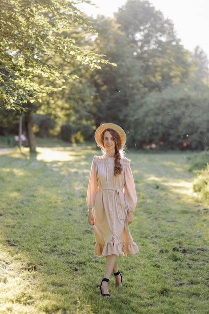 Young couple in love outdoor.Stunning sensual outdoor portrait of young stylish fashion couple posing in summer in field