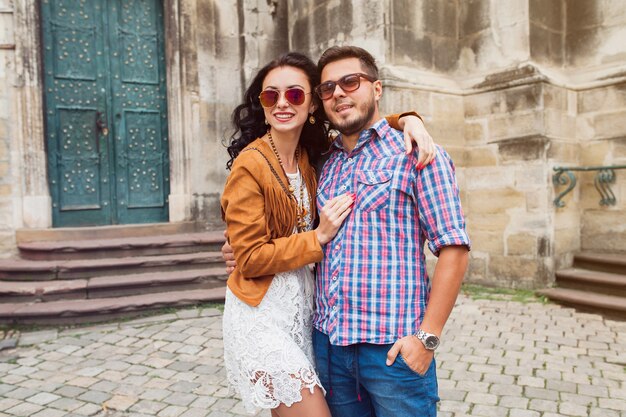 Young couple in love posing in old town