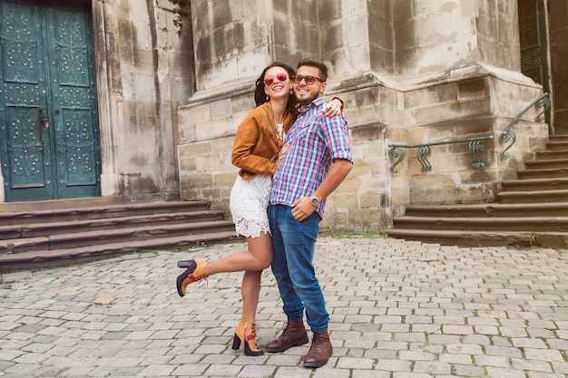 Young couple in love posing in old town