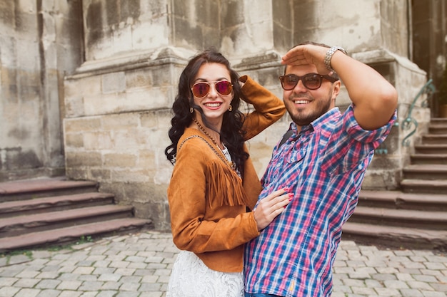 Young couple in love posing in old town