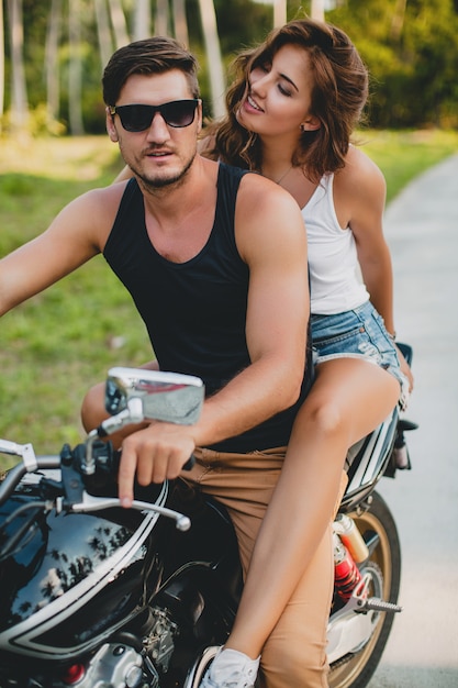 Free photo young couple in love, riding a motorcycle