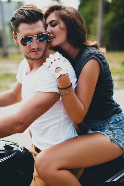 Young couple in love, riding a motorcycle