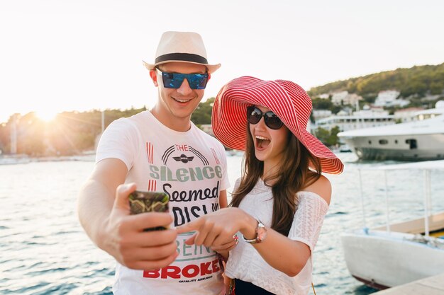 Young couple in love traveling on romantic honeymoon in greece and croatia