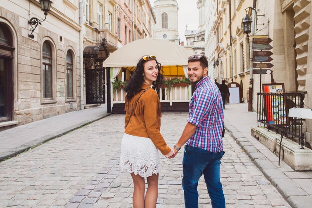 Young couple in love walking in old town