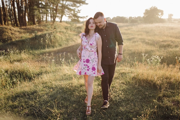 Young couple in love walking in the park