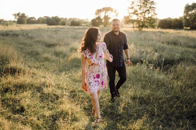 Young couple in love walking in the park