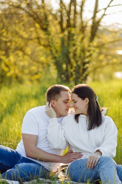 A young couple in love walks in the woods, having a good time together