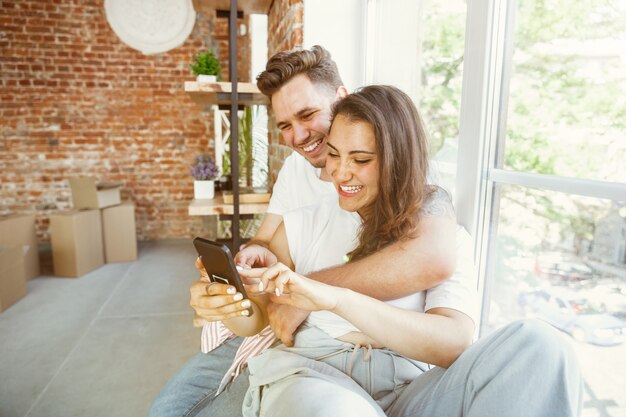 Young couple moved to a new house or apartment.