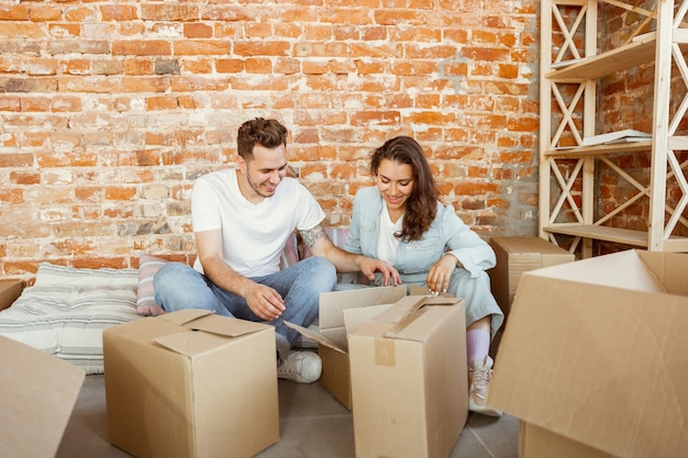 Free photo young couple moved to a new house or apartment.