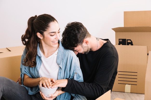 Young couple and moving boxes