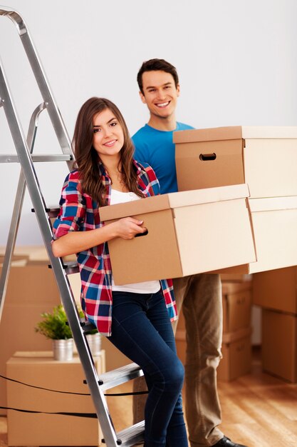 Young couple during moving in home