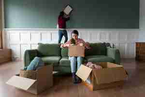 Free photo young couple moving into a new home