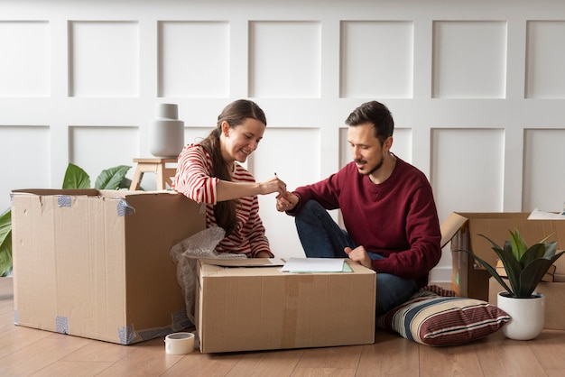 Free photo young couple moving into a new home