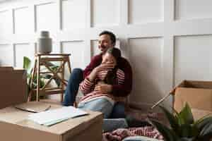 Free photo young couple moving into a new home