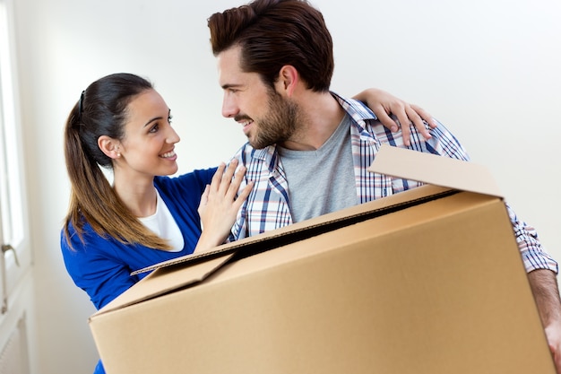 Young couple moving in new home 