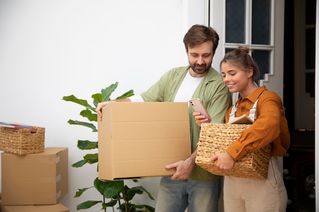Free photo young couple moving in new home